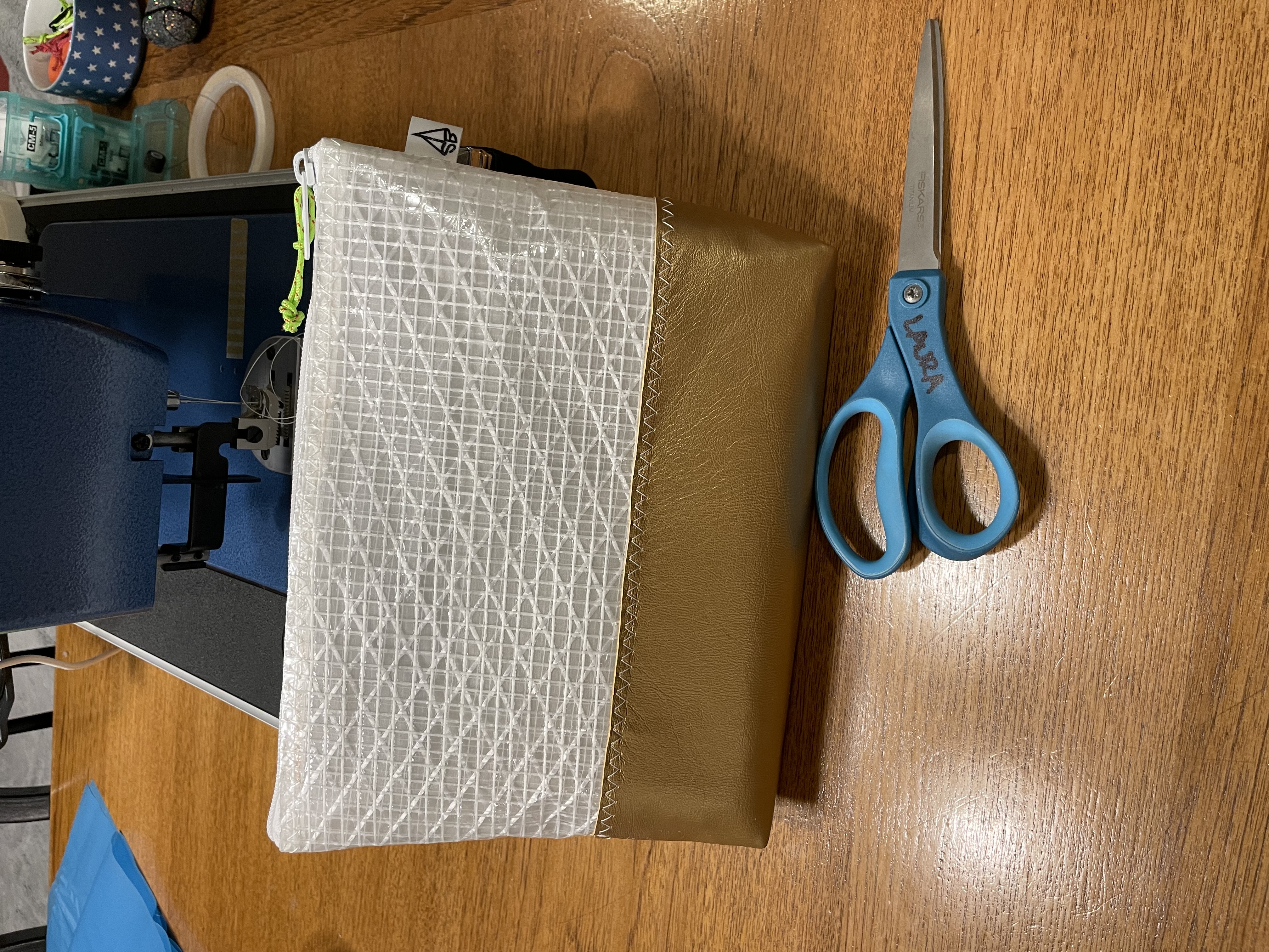 Gold-bottom pouch on the bench