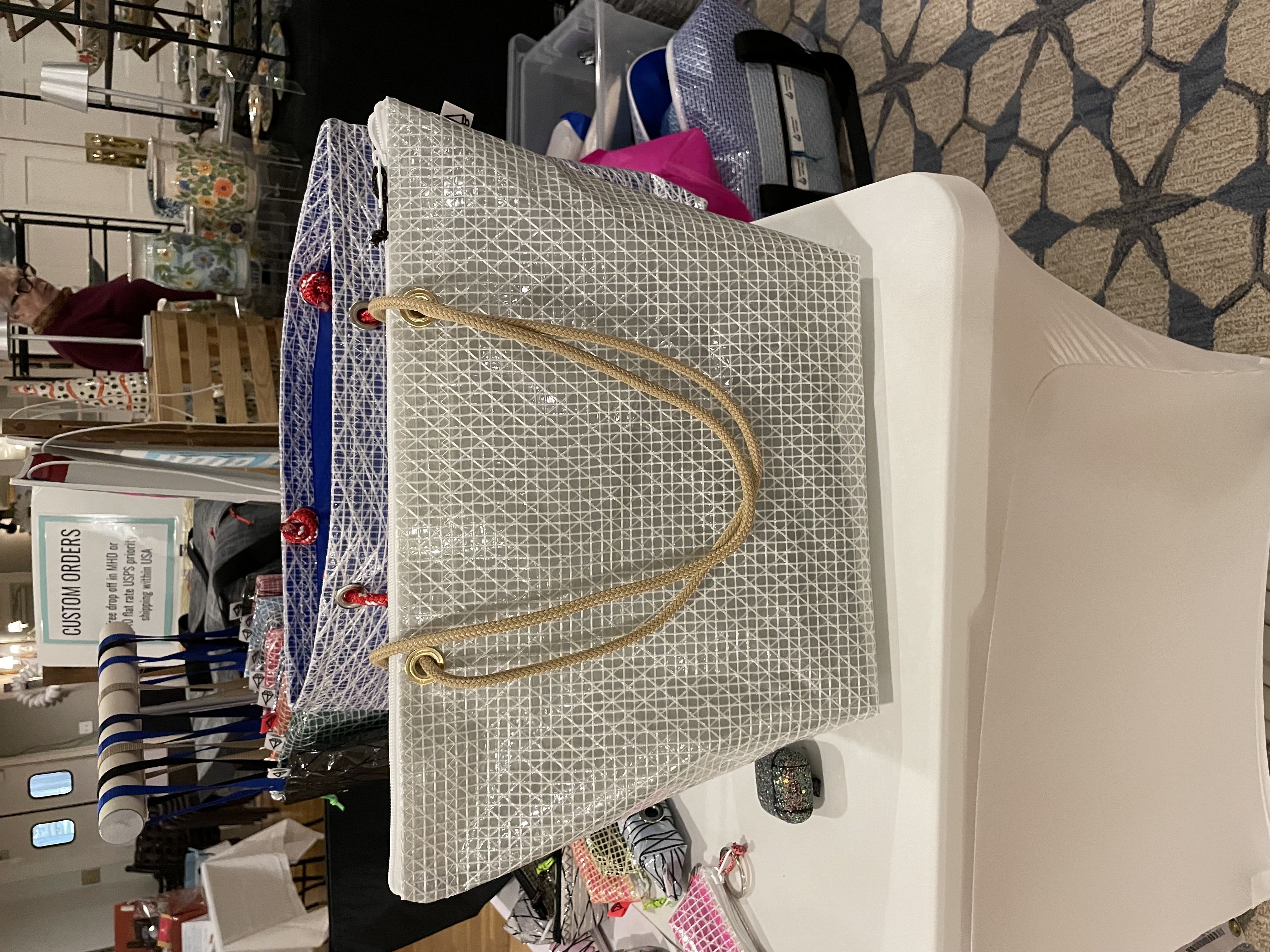 White scrim tote at the show