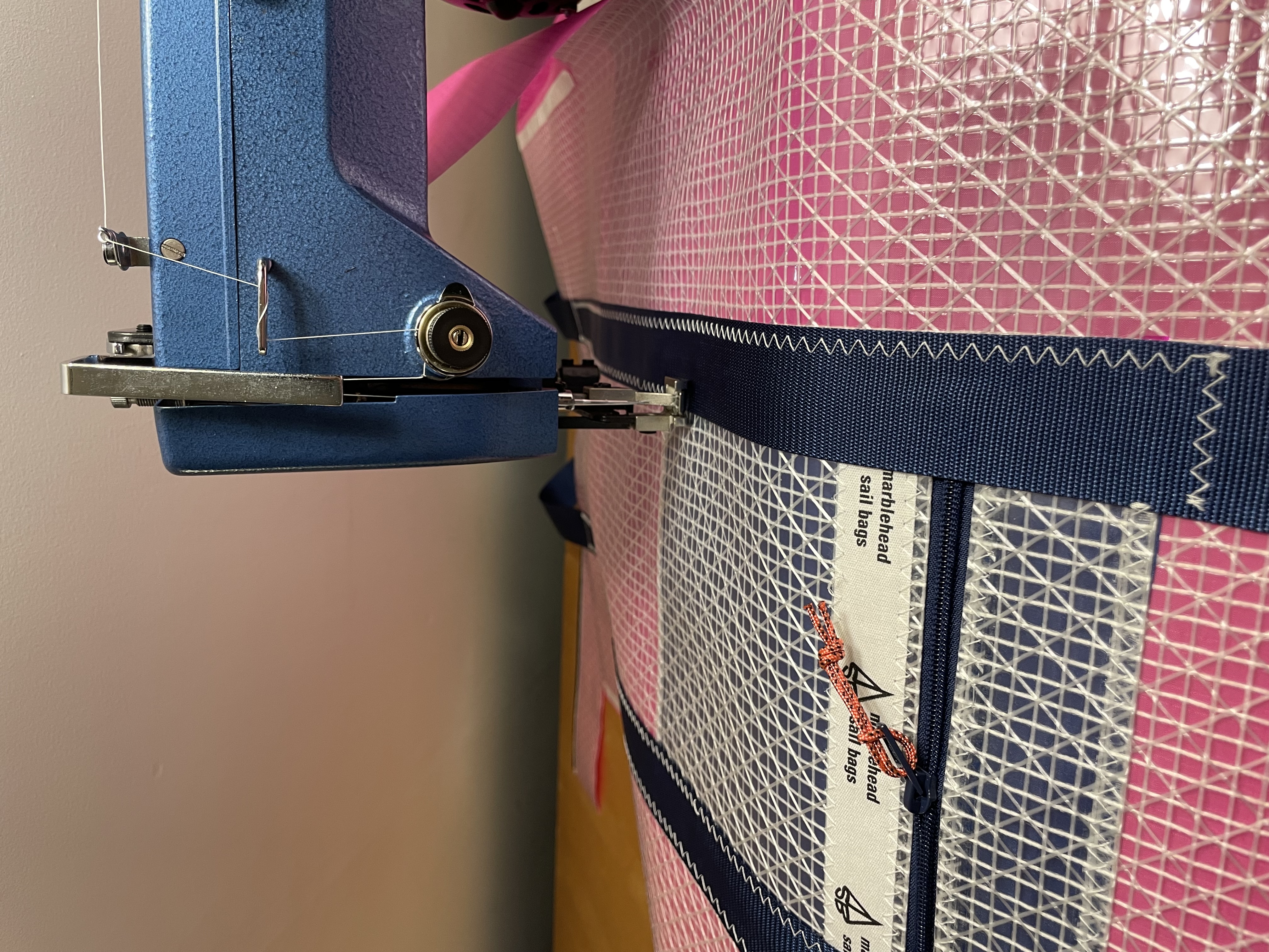 Zigzag-stitching a sailcloth panel at the machine